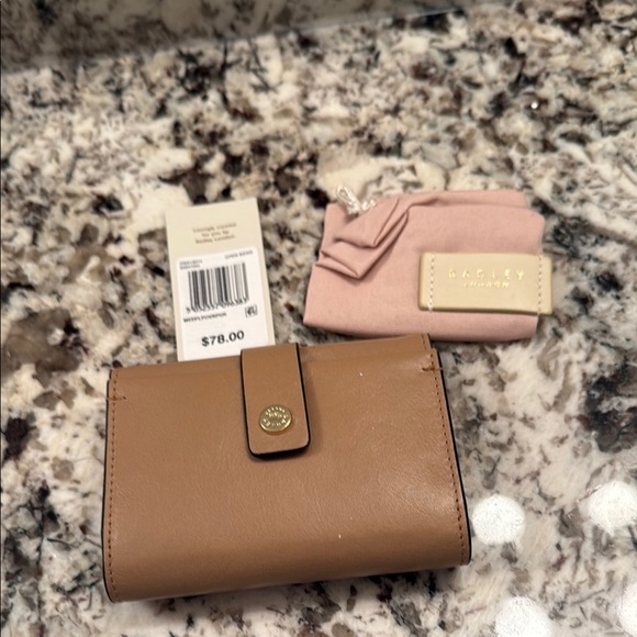 RADLEY LONDON Handbags - Radley London light beige Leather Wallet .. nwt
Authentic .. gold snap logo